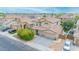 Charming two-story home featuring a tile roof and a spacious three-car garage and landscaped front yard at 10613 E Knowles Ave, Mesa, AZ 85209