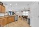 Kitchen area featuring stainless steel appliances, modern lighting, and an open layout to the dining area at 10613 E Knowles Ave, Mesa, AZ 85209