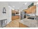 Updated kitchen with granite countertops, stainless steel appliances, and light wood cabinets at 10613 E Knowles Ave, Mesa, AZ 85209