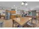 Open concept living area with a dining table, adjacent kitchen, and natural lighting at 10613 E Knowles Ave, Mesa, AZ 85209