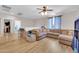 Spacious living room features a large sectional sofa, neutral walls, and a ceiling fan at 10613 E Knowles Ave, Mesa, AZ 85209