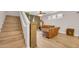Open-concept living room with staircase, hardwood floors, and natural light at 10613 E Knowles Ave, Mesa, AZ 85209