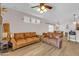 Spacious living room with hardwood floors and natural light open to dining area at 10613 E Knowles Ave, Mesa, AZ 85209