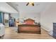 Generous bedroom with hardwood floors, a large bed frame, and a dresser, offering a serene retreat at 10613 E Knowles Ave, Mesa, AZ 85209