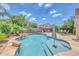 Inviting backyard pool with lush landscaping and spacious tile patio at 10613 E Knowles Ave, Mesa, AZ 85209