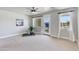Bright bedroom with neutral tones, carpet, large windows, and a ceiling fan, offering ample light at 1111 E Missouri Ave # 9, Phoenix, AZ 85014