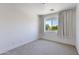 Bright bedroom with a window for natural light, neutral carpet, and neutral paint scheme at 1111 E Missouri Ave # 9, Phoenix, AZ 85014