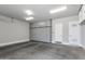 Spacious garage featuring ample storage with gray built-in cabinets and a well-lit interior at 1111 E Missouri Ave # 9, Phoenix, AZ 85014