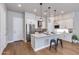 Modern kitchen with stainless steel appliances, white cabinets, and a central island with seating at 1111 E Missouri Ave # 9, Phoenix, AZ 85014