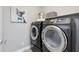 The laundry room features front loading washer and dryer and storage shelf at 1111 E Missouri Ave # 9, Phoenix, AZ 85014