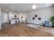 Bright, open-concept living space with hardwood floors, modern decor, and a clear view of the kitchen at 1111 E Missouri Ave # 9, Phoenix, AZ 85014
