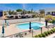 Relaxing community pool area featuring lounge chairs and covered parking in the background at 1111 E Missouri Ave # 9, Phoenix, AZ 85014