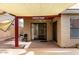 Covered back patio with ceiling fan offers a relaxing outdoor space for entertaining at 11290 E Poinsettia Dr, Scottsdale, AZ 85259