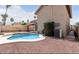 Backyard features a private pool, mature trees, and a desert landscaped low maintenance yard at 11290 E Poinsettia Dr, Scottsdale, AZ 85259