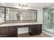 Bathroom features a dual sink vanity with quartz countertops and a glass enclosed shower at 11290 E Poinsettia Dr, Scottsdale, AZ 85259