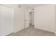 Bedroom with neutral carpet, white walls, and a closet at 11290 E Poinsettia Dr, Scottsdale, AZ 85259
