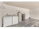 Spacious laundry room with washer, dryer, and water heater hookups in a well-lit space at 11290 E Poinsettia Dr, Scottsdale, AZ 85259