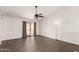 Spacious living room with tile floors and sliding glass doors to the backyard at 11290 E Poinsettia Dr, Scottsdale, AZ 85259