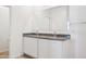 Bathroom with double sink, granite countertop, and large mirror at 12232 E Agave Ln, Florence, AZ 85132
