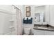 Neutral bathroom features a shower-tub combo, granite countertop and stylish mirror and decorative towels at 12247 E Agave Ln, Florence, AZ 85132