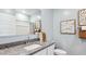 Stylish bathroom with gray granite countertops, decorative wall hangings and modern fixtures at 12247 E Agave Ln, Florence, AZ 85132