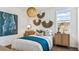 Cozy bedroom features a queen bed, stylish nightstands, decorative accents, and a bright window at 12247 E Agave Ln, Florence, AZ 85132