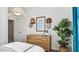 Bedroom with dresser, western themed decorations and a houseplant at 12247 E Agave Ln, Florence, AZ 85132