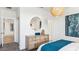 Bedroom with a light wood dresser, modern décor, and neutral carpet at 12247 E Agave Ln, Florence, AZ 85132