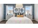 Beautiful main bedroom featuring patterned wallpaper, bedside tables, decorative lamps, and plush pillows at 12247 E Agave Ln, Florence, AZ 85132