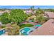 Inviting backyard showcasing a sparkling pool, outdoor seating, and plenty of green space at 1292 N Renee Ave, Gilbert, AZ 85234