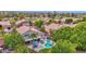A backyard retreat with a refreshing pool, comfortable seating, and mature trees at 1292 N Renee Ave, Gilbert, AZ 85234