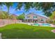 Expansive backyard with lush lawn, inviting pool, and patio, perfect for outdoor entertaining and relaxation at 1292 N Renee Ave, Gilbert, AZ 85234