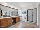 This bathroom boasts dual sinks, a separate tub, and walk-in shower with great natural light at 1292 N Renee Ave, Gilbert, AZ 85234