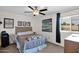 Well-lit bedroom with a simple bed and stylish artwork, offering a serene living space at 1292 N Renee Ave, Gilbert, AZ 85234