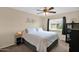 Cozy bedroom featuring a ceiling fan and a comfortable bed with soft, white bedding at 1292 N Renee Ave, Gilbert, AZ 85234