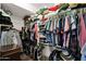 Organized walk-in closet with hanging racks and shelving for ample storage at 1292 N Renee Ave, Gilbert, AZ 85234