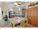 Bright dining area with seating for six and views into kitchen and built-in workstation at 1292 N Renee Ave, Gilbert, AZ 85234