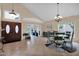 Formal dining room with vaulted ceilings and a glass table set with seating for six at 1292 N Renee Ave, Gilbert, AZ 85234