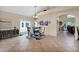 Dining room with a glass table, seating for six, and an arched entryway at 1292 N Renee Ave, Gilbert, AZ 85234