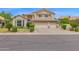 Attractive home showcasing a spacious three-car garage, lush landscaping, and inviting curb appeal at 1292 N Renee Ave, Gilbert, AZ 85234