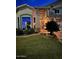 Beautifully landscaped front yard with lush green grass, mature shrubs, and flag at 1292 N Renee Ave, Gilbert, AZ 85234