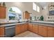 Modern kitchen featuring granite countertops and wooden cabinets at 1292 N Renee Ave, Gilbert, AZ 85234