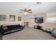 Upstairs bonus/living room with lots of open space, carpeting and a ceiling fan at 1292 N Renee Ave, Gilbert, AZ 85234