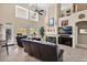 Bright living room with a fireplace, high ceilings, and a wall of windows at 1292 N Renee Ave, Gilbert, AZ 85234