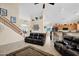 Inviting living room with a staircase and view of the kitchen with bar seating at 1292 N Renee Ave, Gilbert, AZ 85234