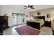Spacious main bedroom featuring a ceiling fan and access to the outdoor patio at 1292 N Renee Ave, Gilbert, AZ 85234