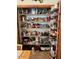 Walk-in pantry with storage shelves, containers and canned goods at 1292 N Renee Ave, Gilbert, AZ 85234