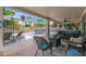 Inviting covered patio with comfortable seating, a hot tub, and a view of the lush backyard at 1292 N Renee Ave, Gilbert, AZ 85234