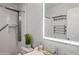 Updated bathroom with modern fixtures, tiled shower, and stylish vanity with mirror at 13608 N 19Th Pl, Phoenix, AZ 85022