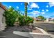 Beautiful front yard with mature desert landscaping and a charming home exterior at 13608 N 19Th Pl, Phoenix, AZ 85022